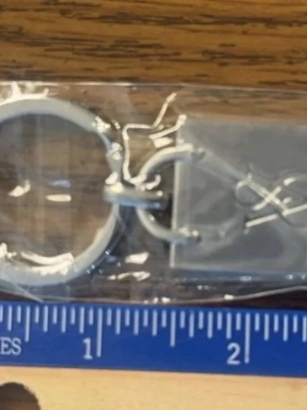 Victoria's Secret stainless steel keychain with a laser-cut VS logo